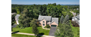 an aerial view of a home in a wooded area