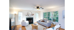 a living room filled with furniture and a fire place