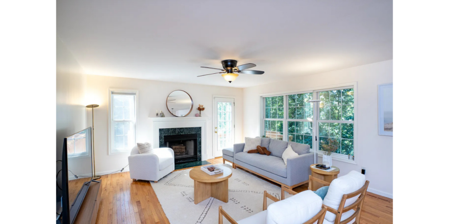 a living room filled with furniture and a fire place