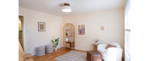 a living room filled with furniture and a wooden floor