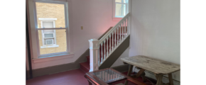 a room with a table and a bench in it