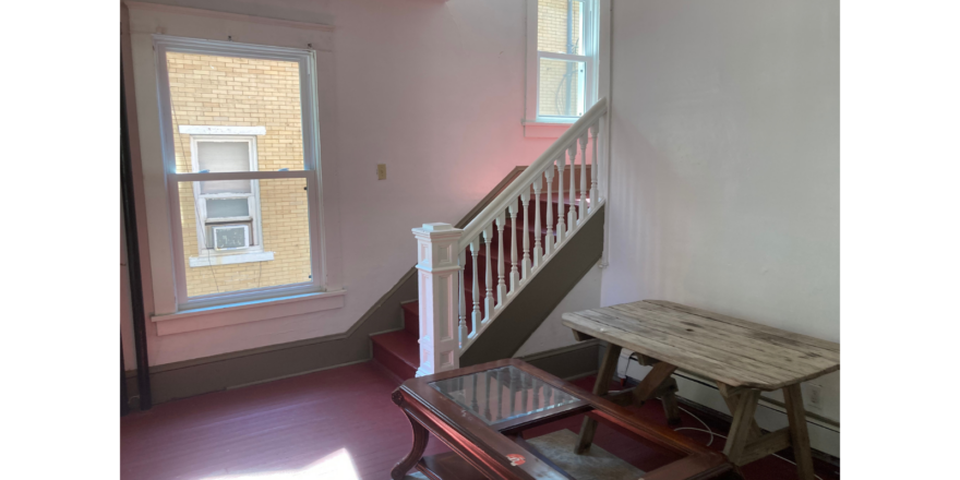 a room with a table and a bench in it