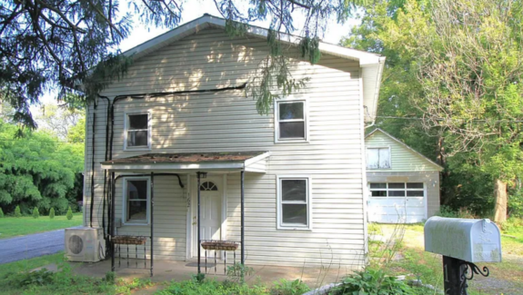a house with a mailbox in front of it
