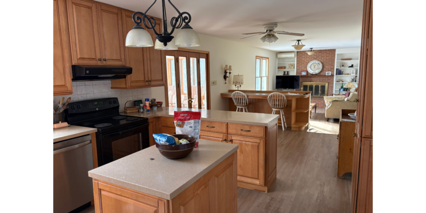 a view of a kitchen from the living room