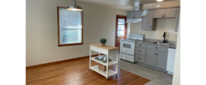 a kitchen with wood floors and a stove top oven