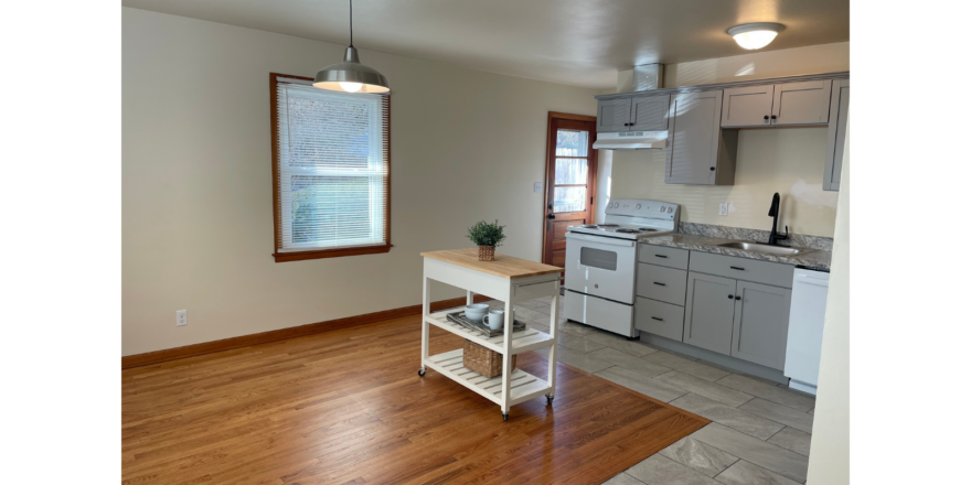 a kitchen with wood floors and a stove top oven