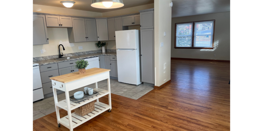 a kitchen with a white refrigerator freezer sitting inside of it
