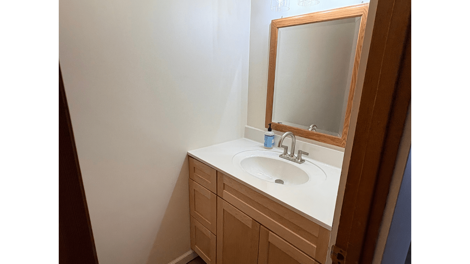 Modern bathroom vanity with oak cabinet