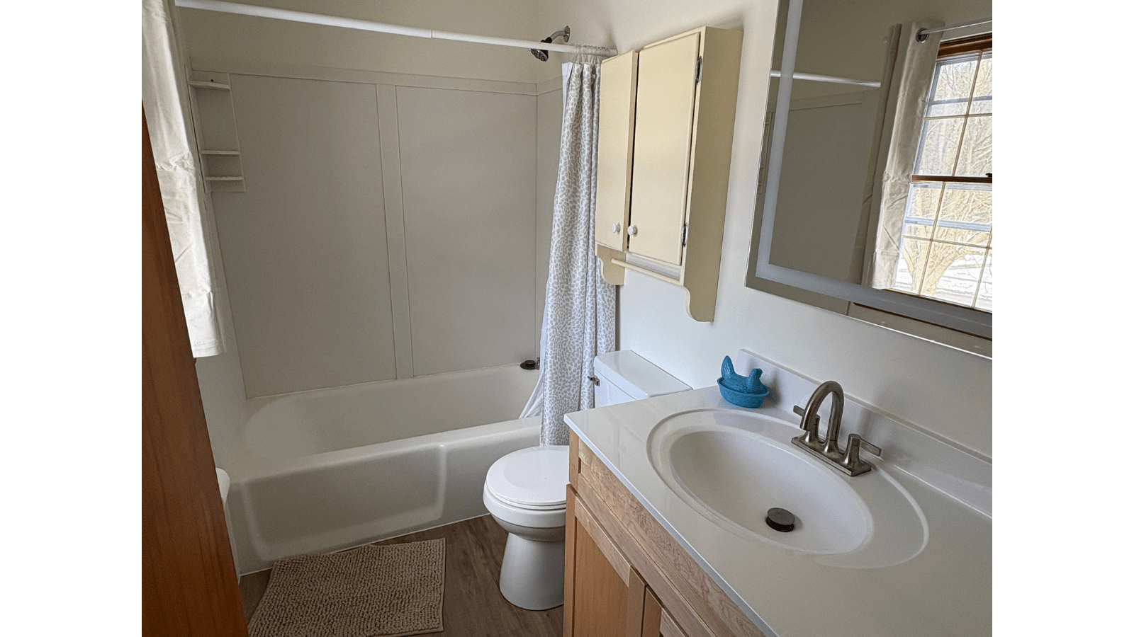 Bathroom with tub, toilet, and vanity