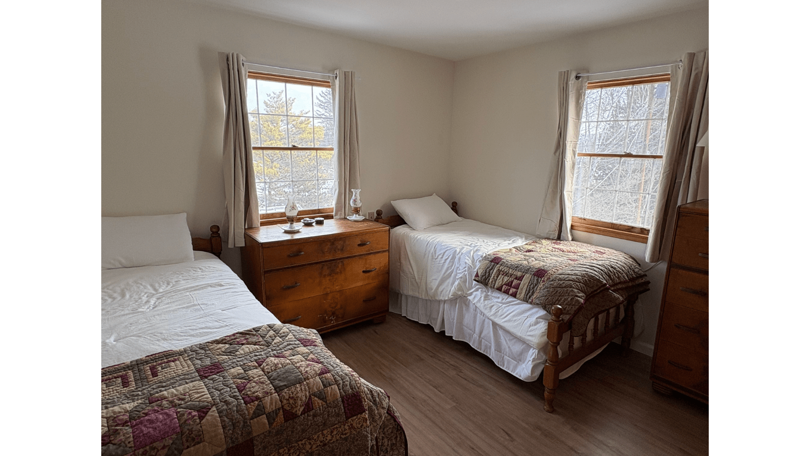 Bedroom with two twin beds and dresser