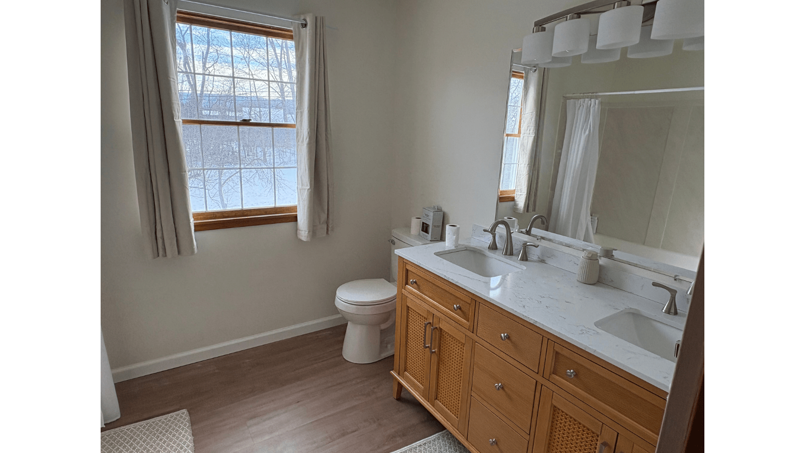 Bathroom with double vanity and window