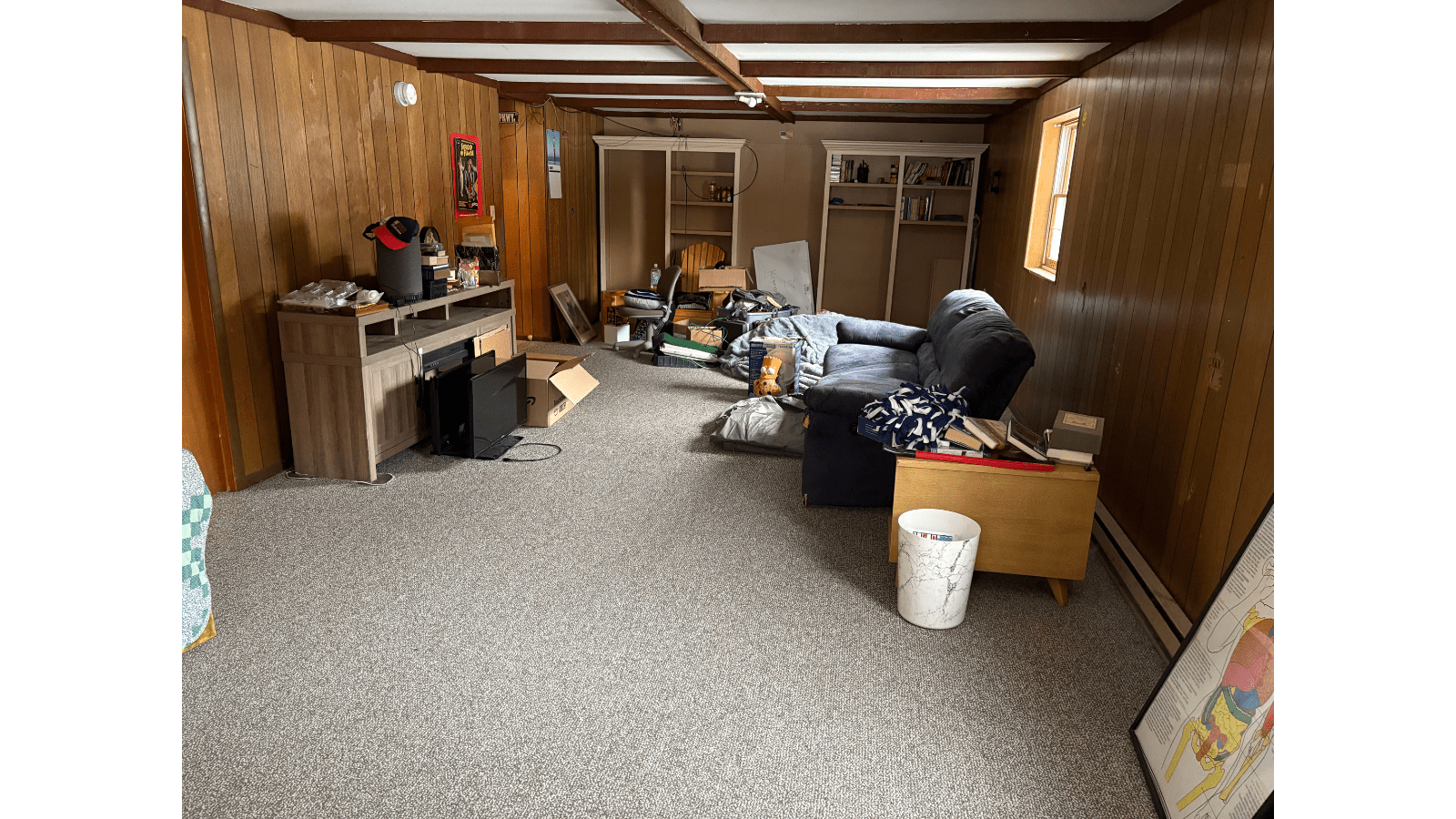 Living room with wood paneling and furniture