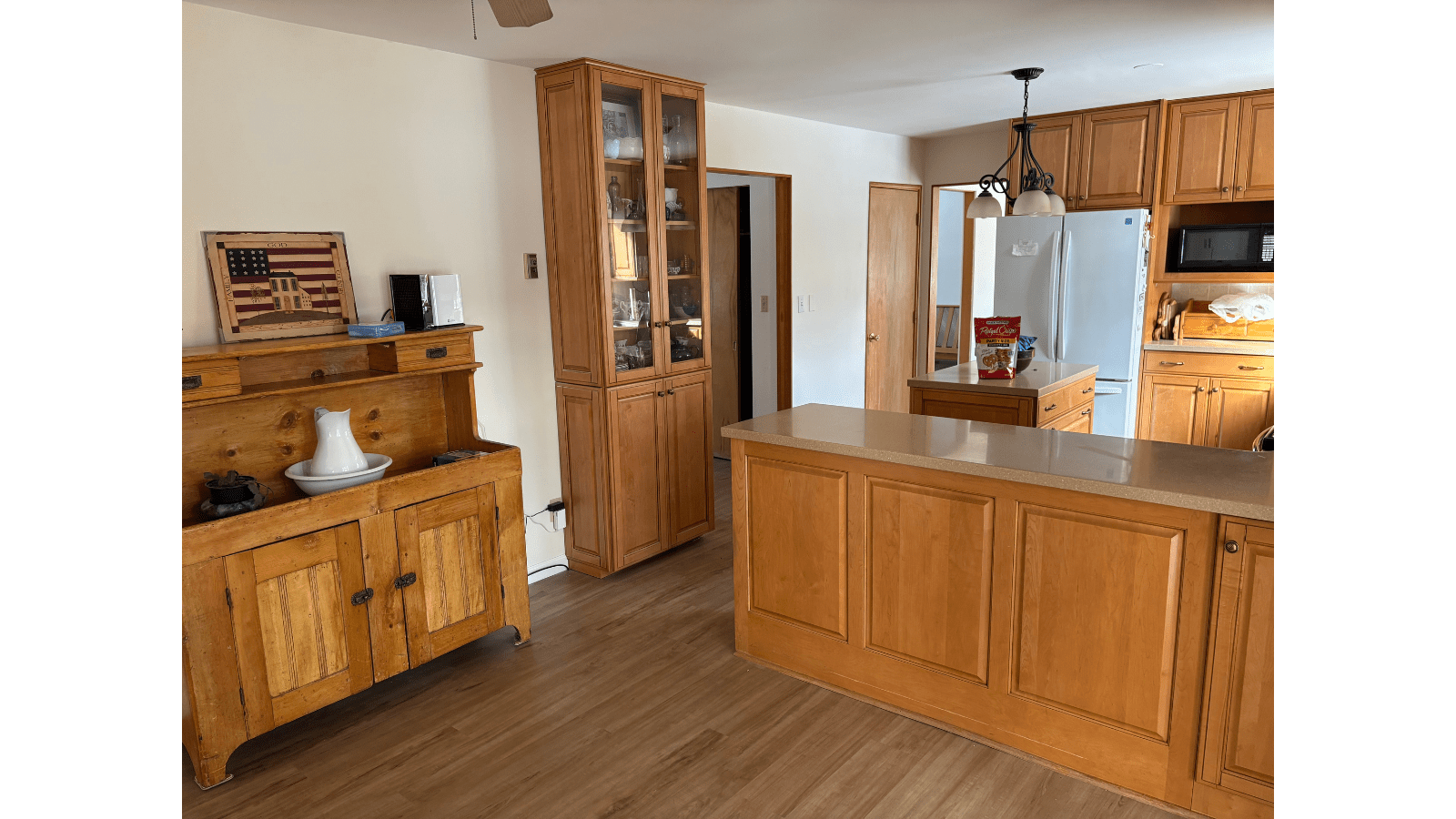 Kitchen with wooden cabinets and island