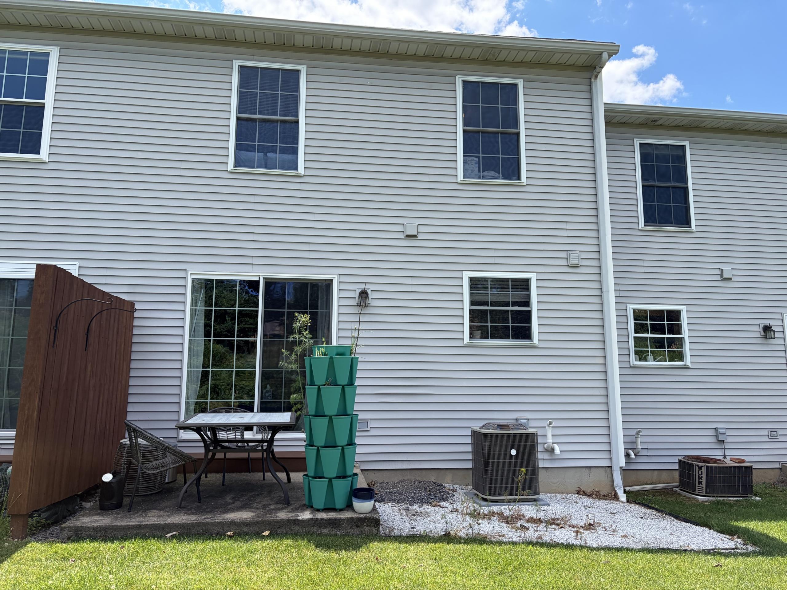 Birchtree Court home exterior with backyard details.