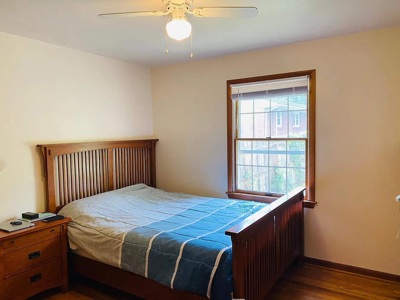 Bedroom with wooden bed and nightstand