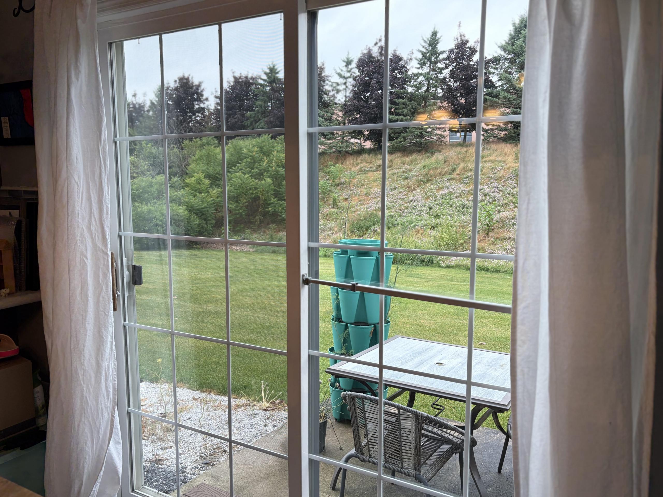 Sliding glass door looking out to backyard.