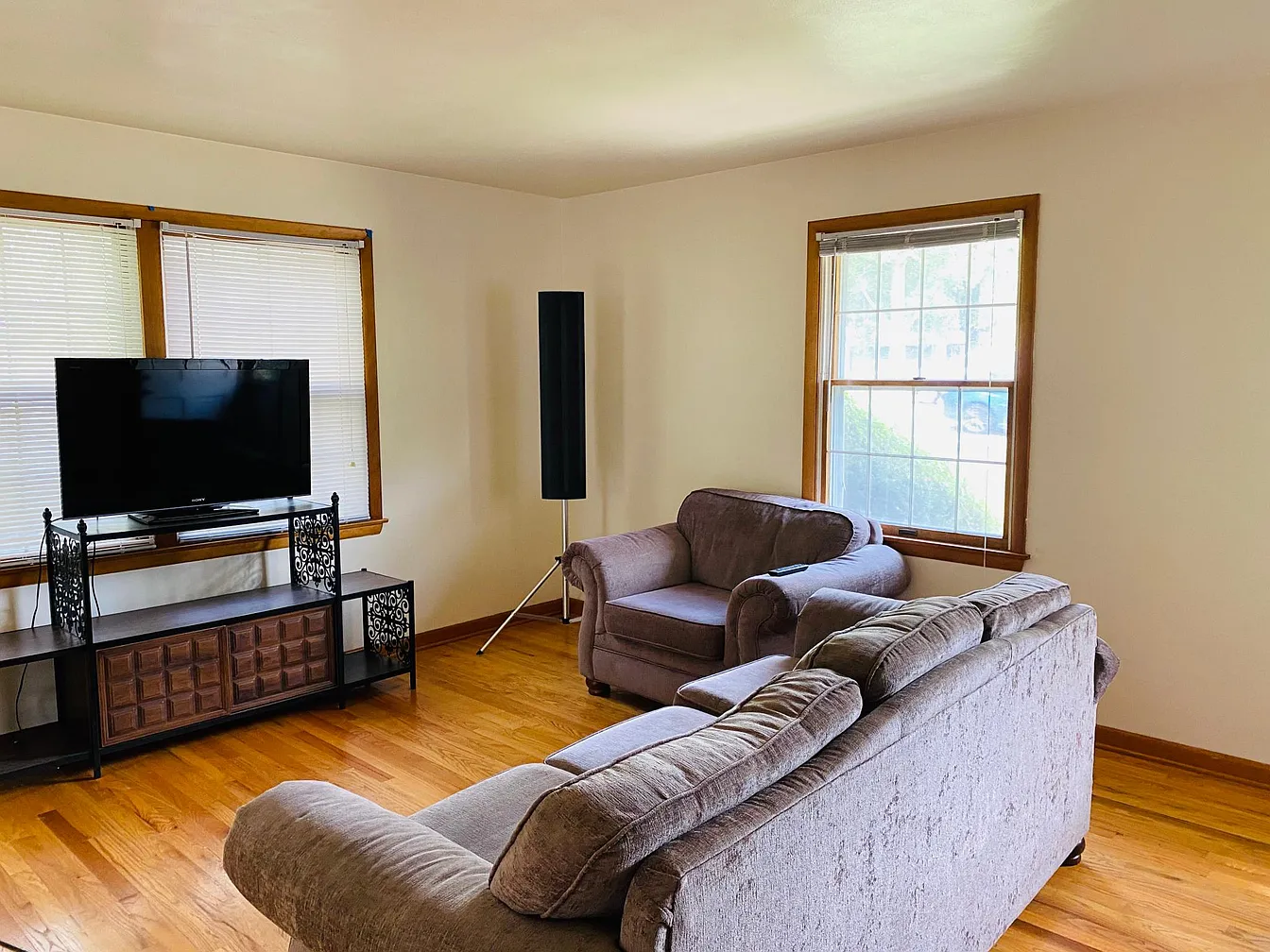 Living room with sofa and armchair