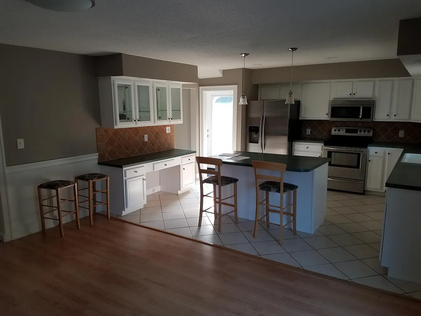 Kitchen with island and white cabinets