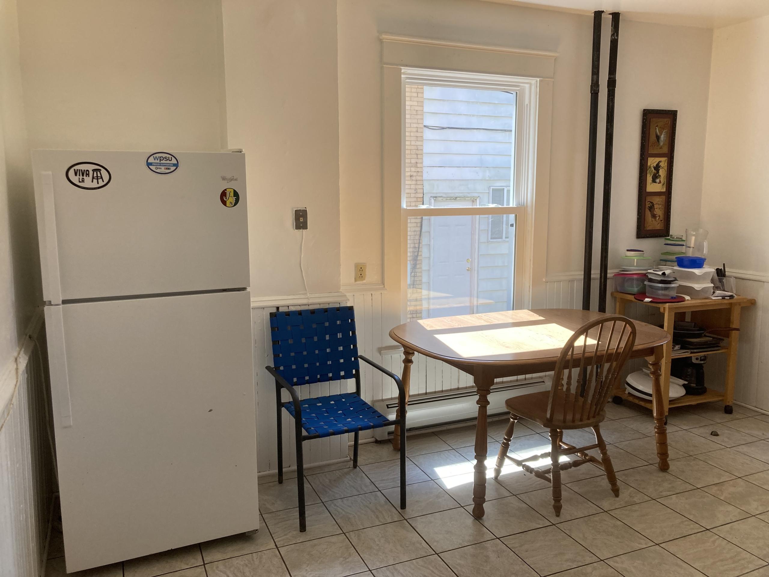 Kitchen table and chairs by window