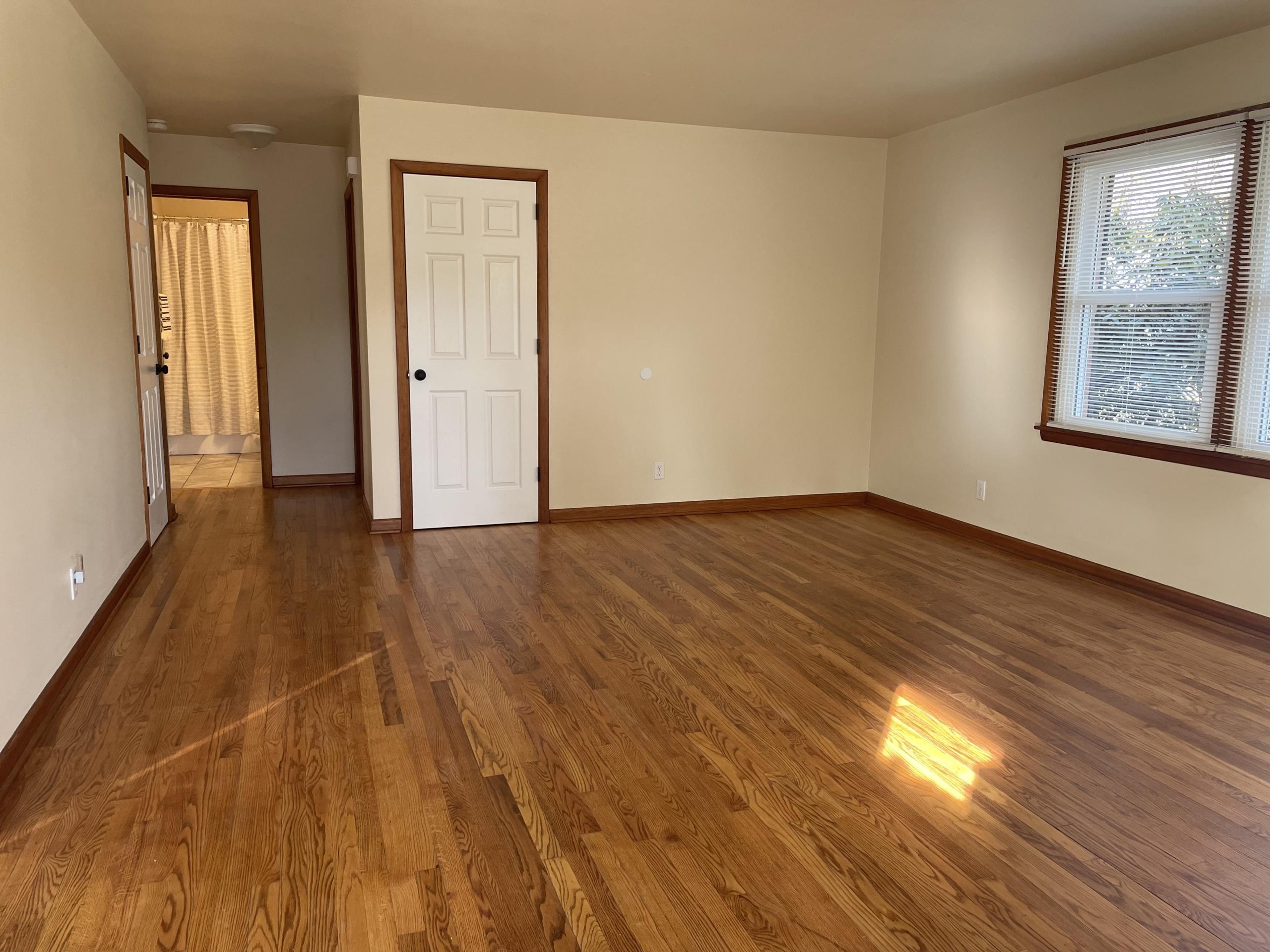 Empty living room with hardwood floors