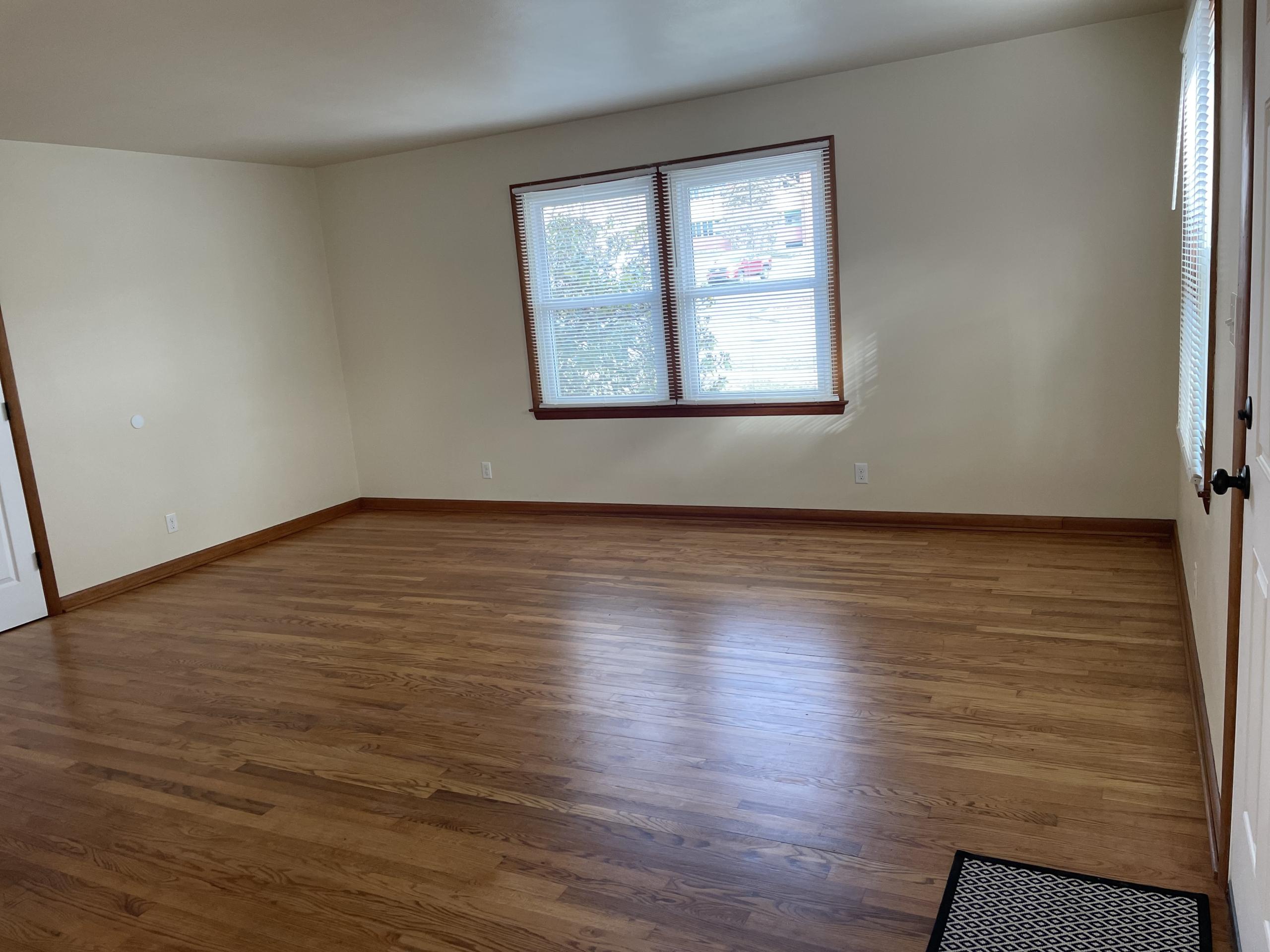 Empty living room with hardwood floors