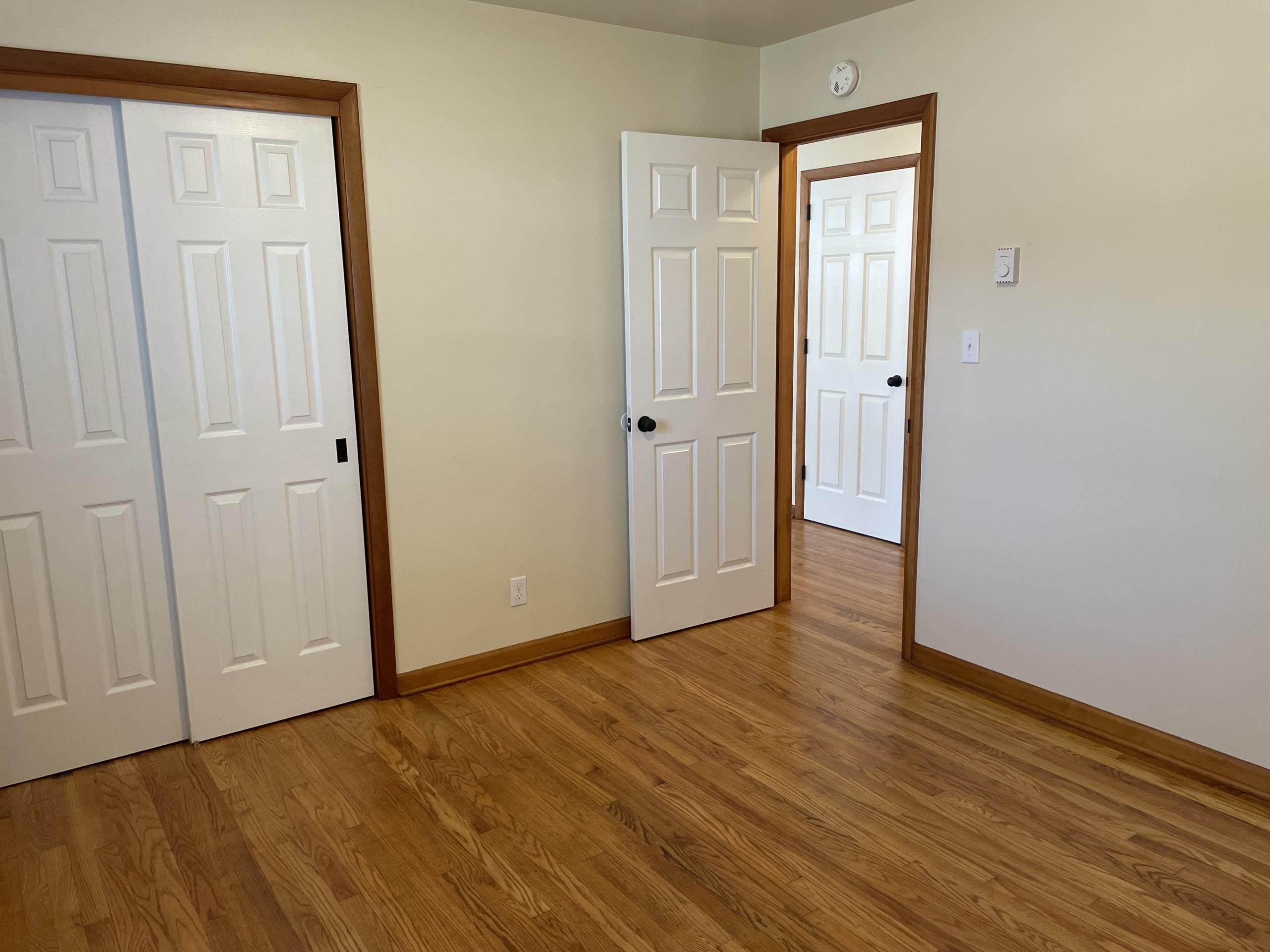 Bedroom with closet and two doors