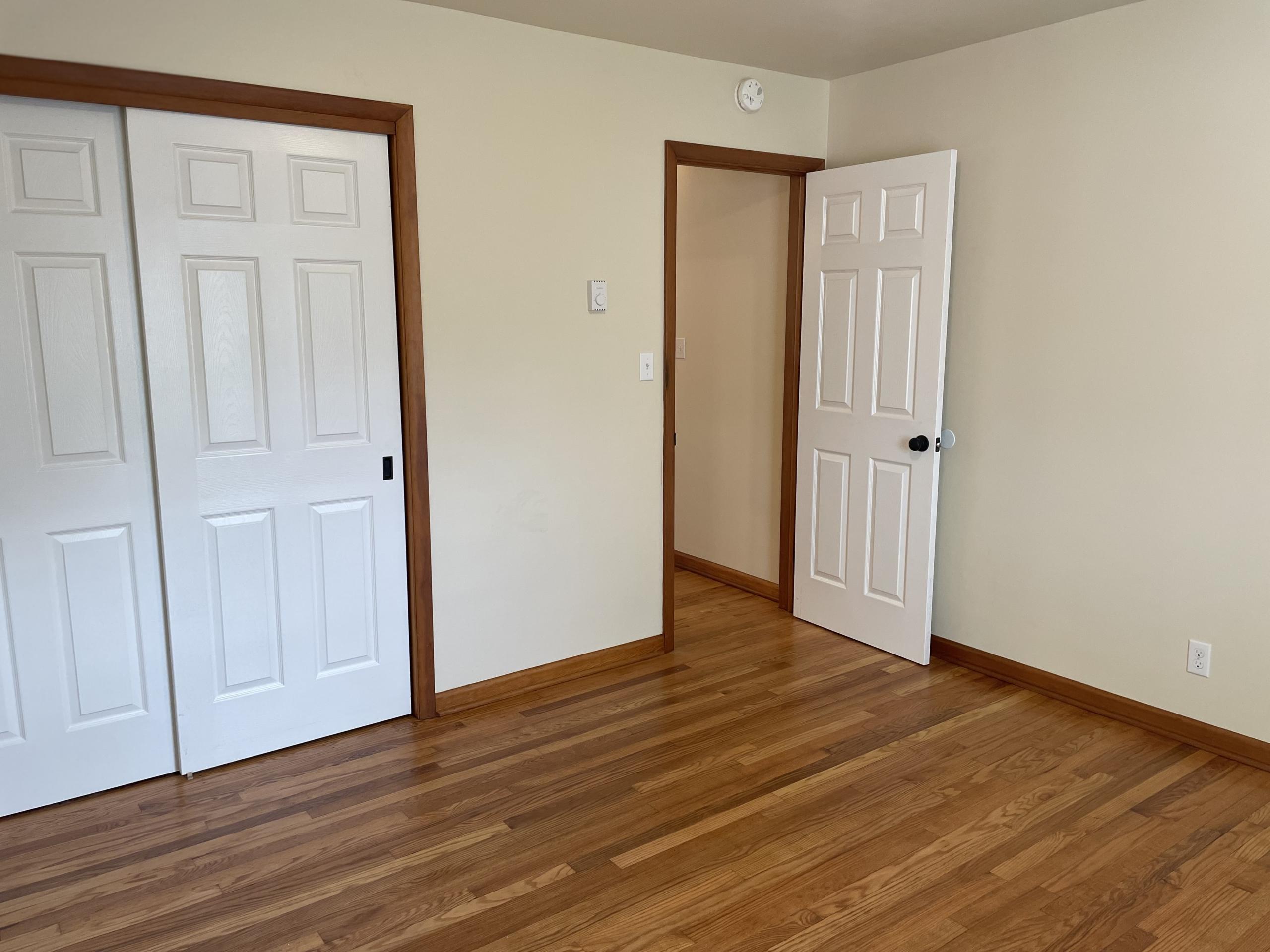 Bedroom with closet and two doors