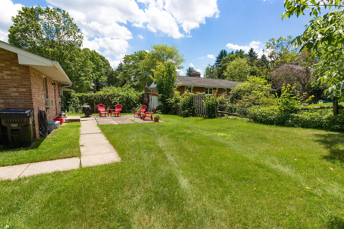 Backyard with patio furniture and lawn
