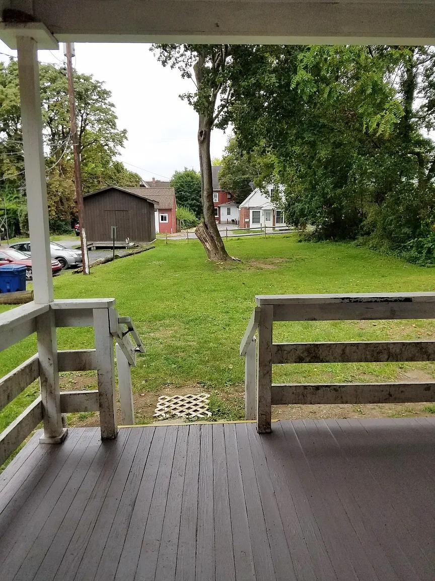 View from porch to backyard with shed