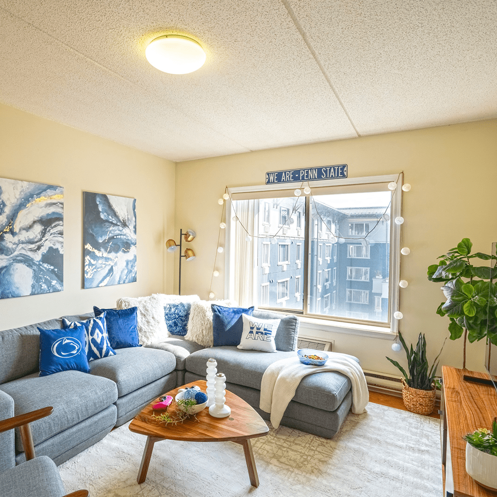 Gray sectional sofa with Penn State decor