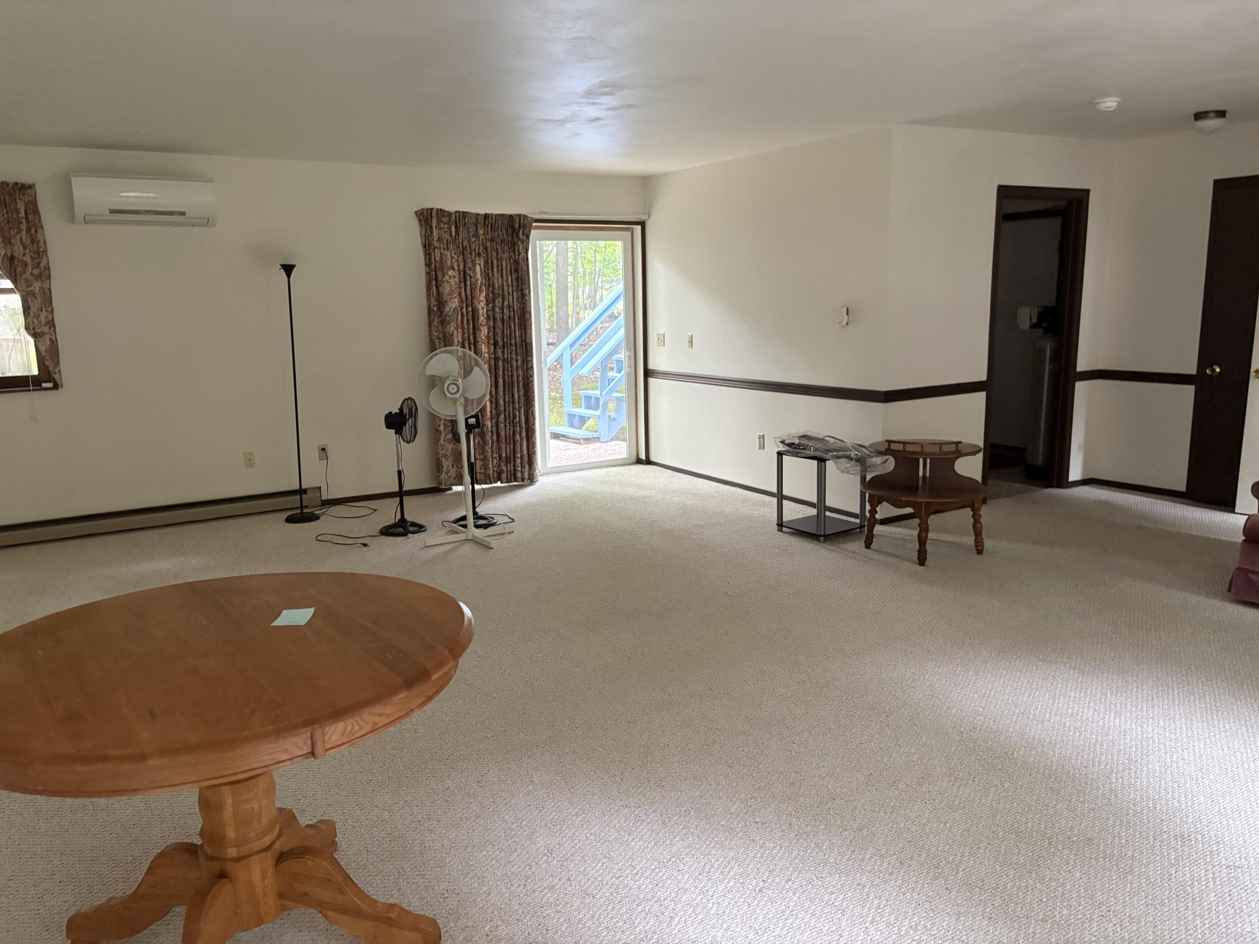 Living room with round table and sliding door