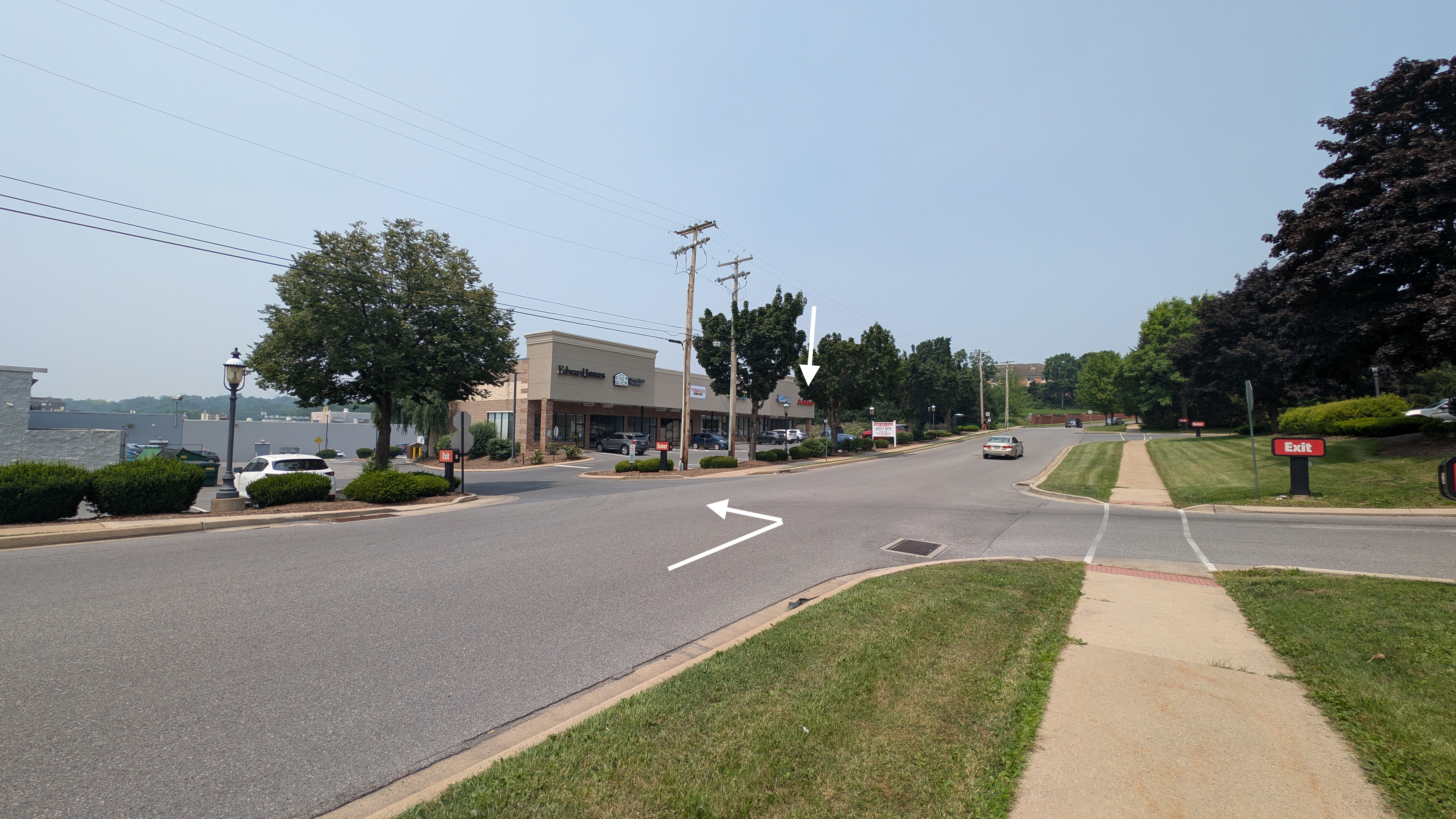 Street intersection with shops and trees