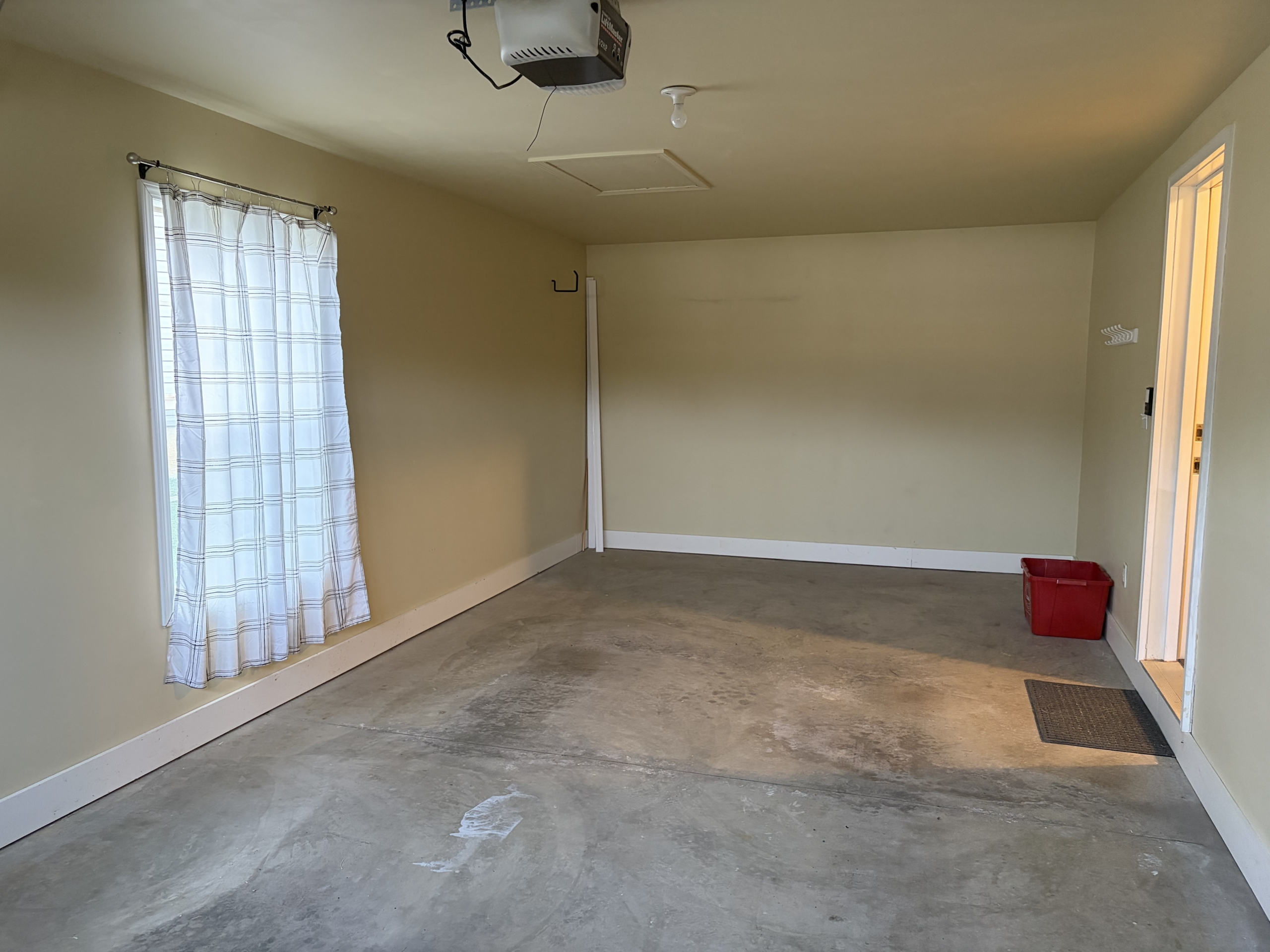 Empty garage interior with yellow walls