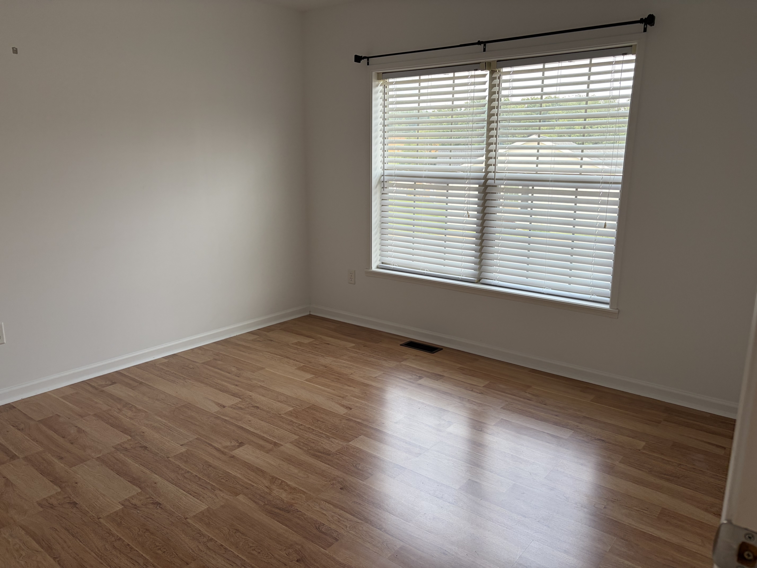 Empty room with wood floor and window