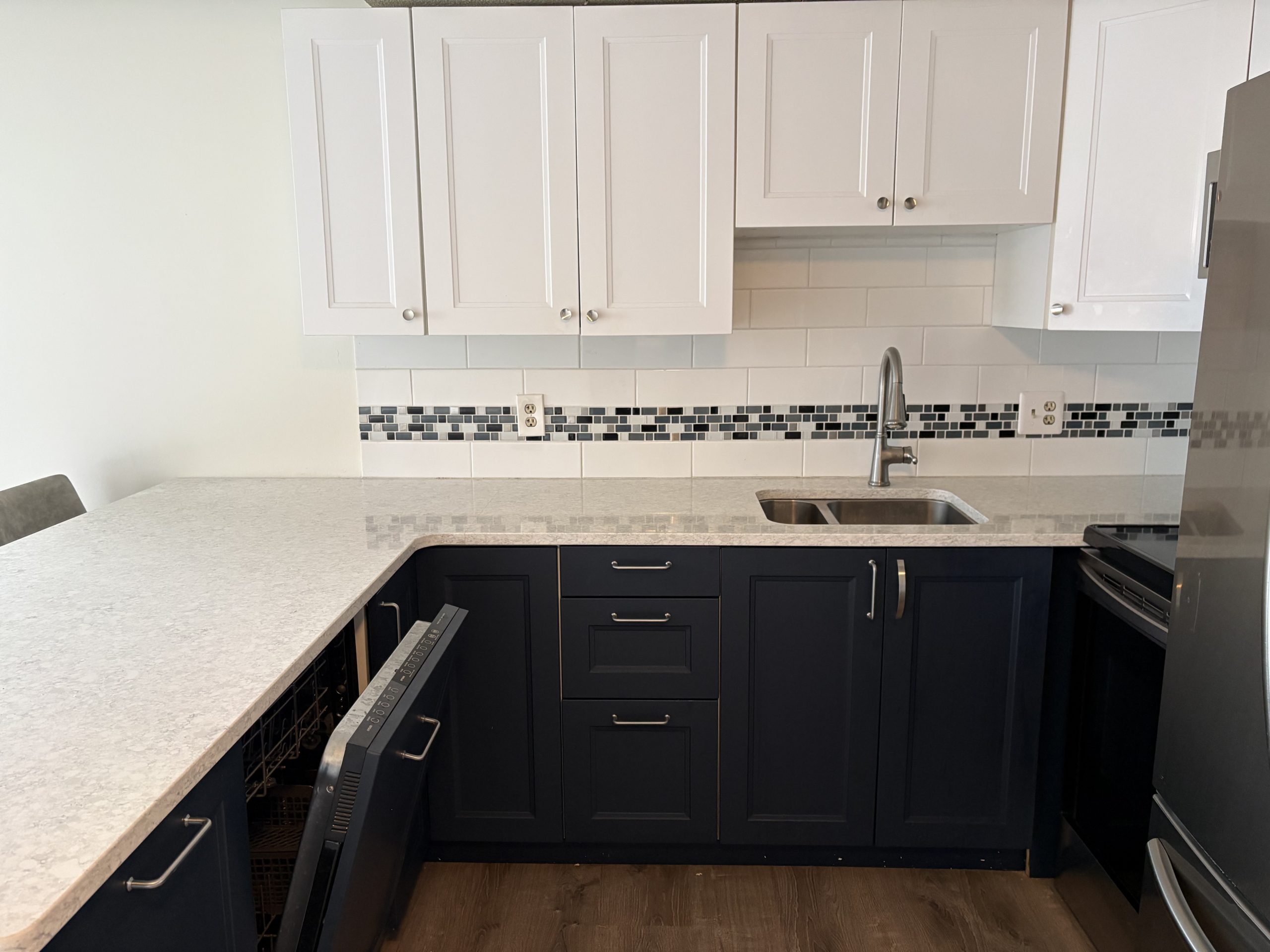 Modern kitchen with white and navy cabinets