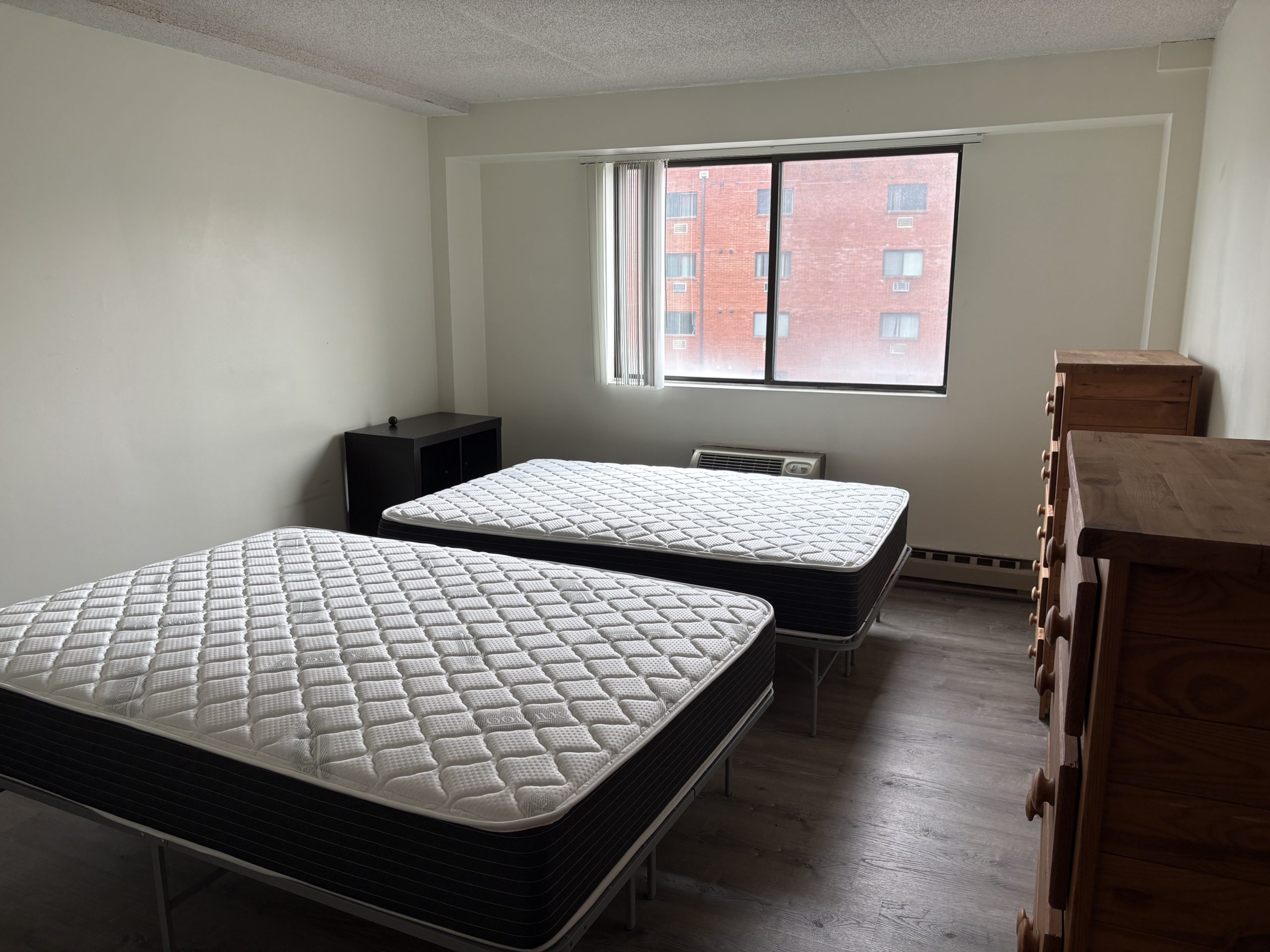 Two beds in empty Hetzel Plaza unit