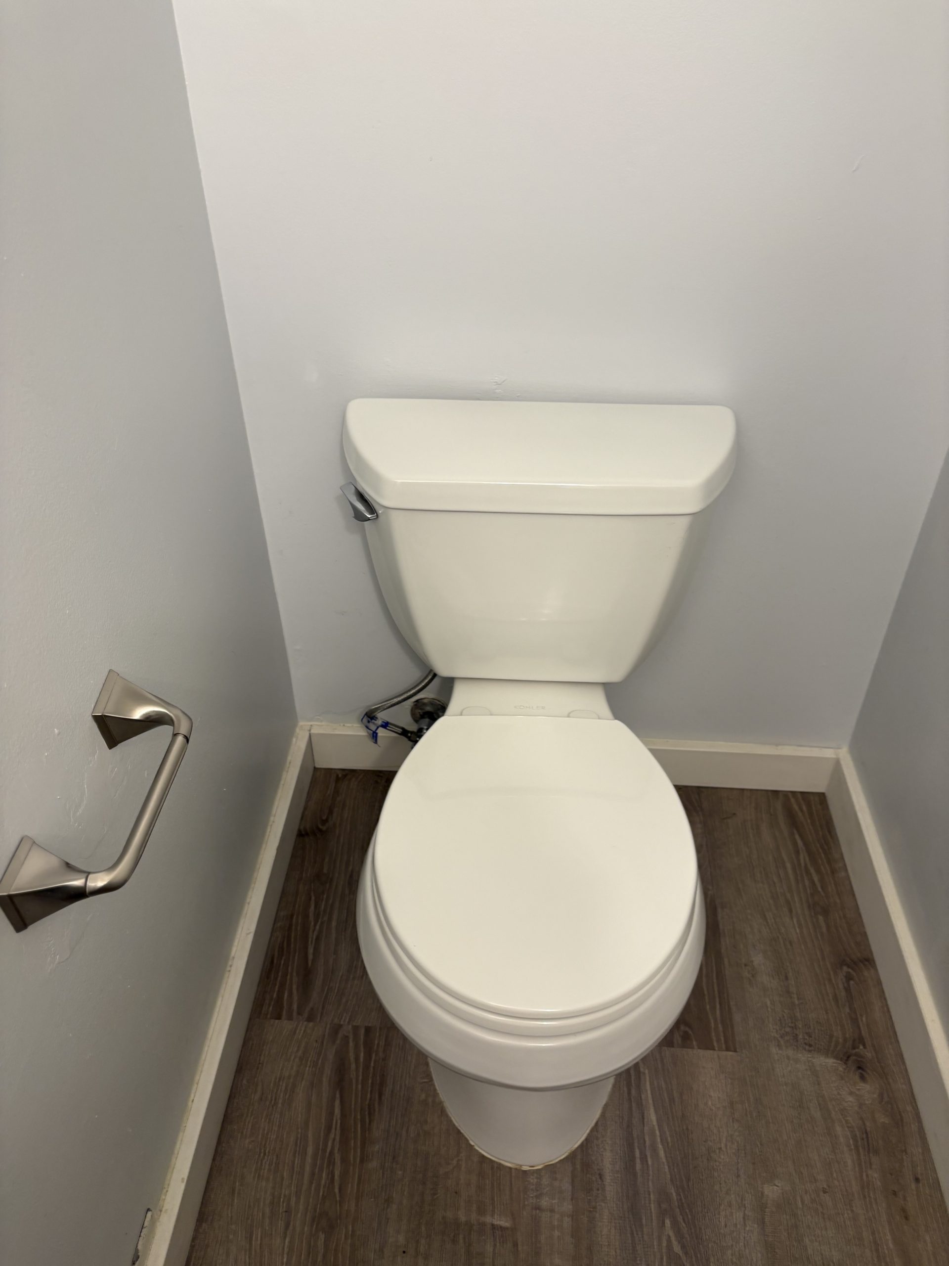 White toilet in a small bathroom