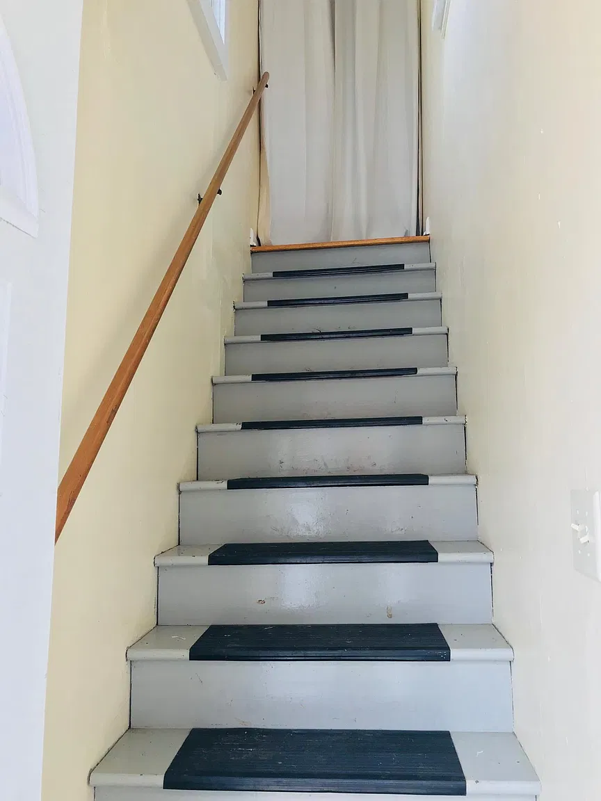 Staircase with wooden handrail